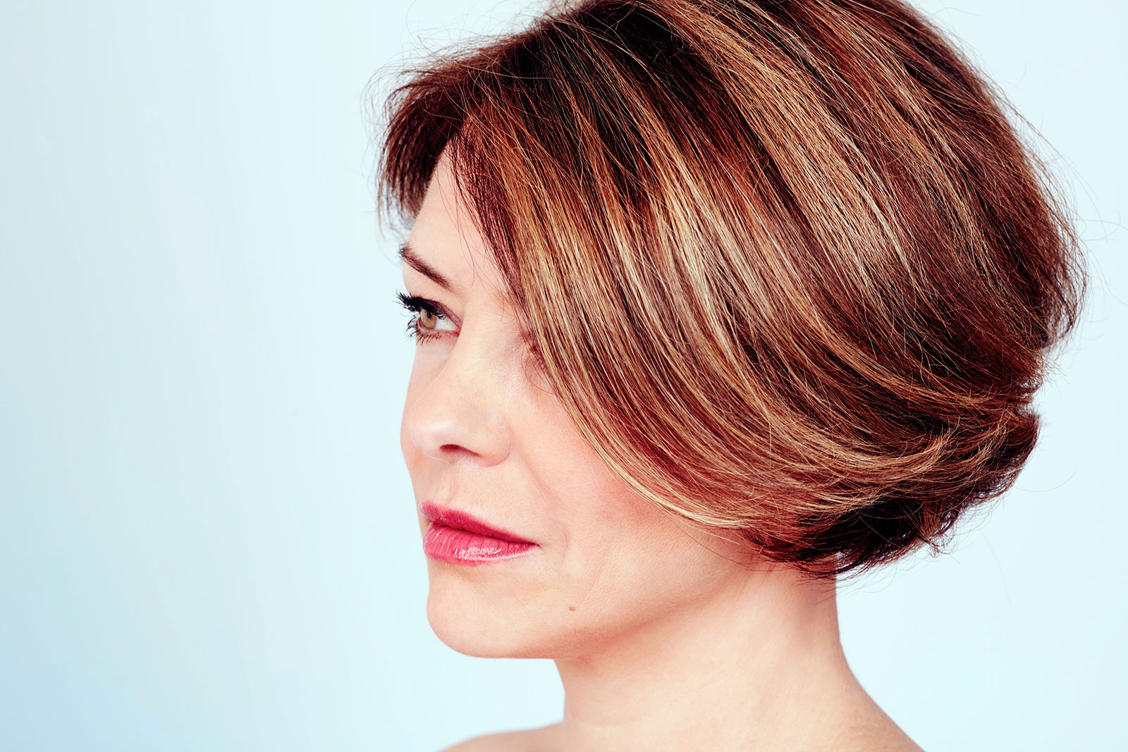 Side-parted bob with back swept layers and soft balayage